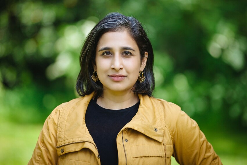 A headshot of Anu Thomas